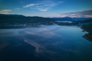 Mist (fog) in Sagfjorden in the sunset.View Sjøvegan in Salangen