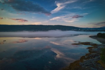 Mist (fog) in Sagfjorden in the sunset.View Sjøvegan in Salangen